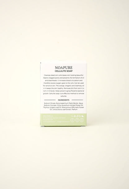 NoaPure Exfoliating Body Ritual Bar packaging in white and pale green on an off-white background