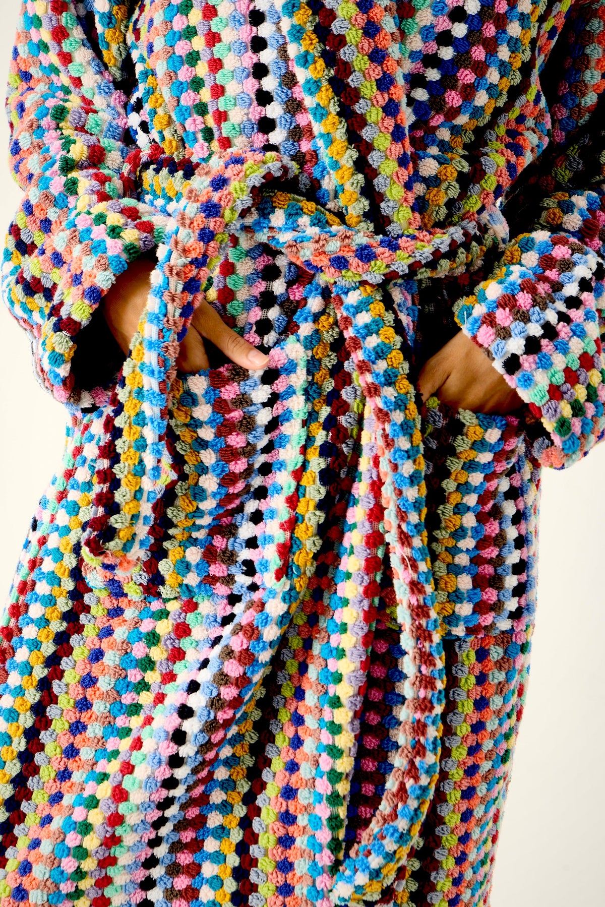 Close-up of the Mosaic Bathrobe woven in multicolor 100% Turkish cotton, pocket and tie belt detail